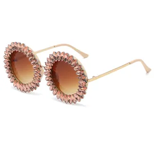 Stylish oversized round sunglasses with pink rhinestone sunburst frame for parties