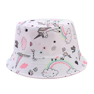 White kids reversible bucket hat with colorful cartoon unicorn and rainbow prints