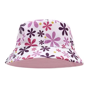 Close-up of children's floral bucket hat with vibrant purple and pink flower print patterns
