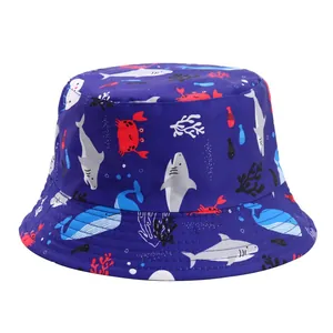 Vibrant close-up of a children's blue bucket hat with shark and crab patterns