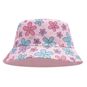 Close-up detail of children's pink bucket hat featuring colorful floral patterns for sun protection