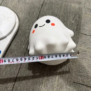 Detailed measurement shot showing the exact width of a cute white ghost squishy toy
