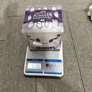 White ghost squishy toy weight measurement showing 513.8 grams on a digital scale