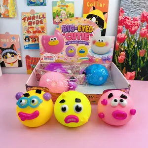 Close-up of colorful TPR big-eyed emoji squishy stress relief toys with display box