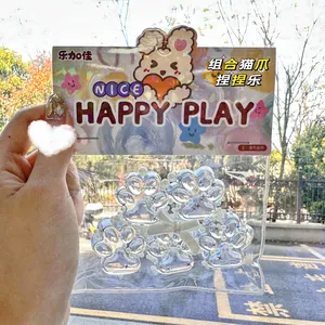 Detailed close-up of transparent cat paw squishy toys in colorful gift packaging