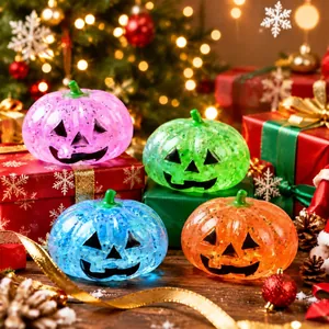 Set of four colorful Jack-o'-lantern pumpkin squishy toys in festive Christmas setting