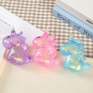 Set mit glitzernden Einhorn-Quetschspielzeugen zum Stressabbau in Lila, Rosa und Blau