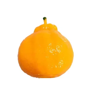 Realistic orange squishy stress relief toy with textured peel and green stem detail.