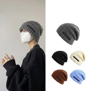 Warm winter knitted slouchy beanie hat with large circumference available in multiple colors