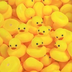 Detailed view of numerous classic yellow rubber duck bath toys for toddlers water play