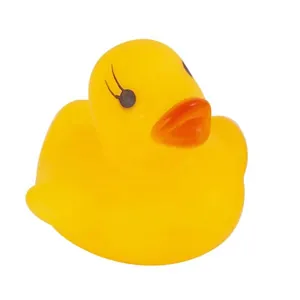 Detail shot of a classic yellow rubber duck floating toy for baby bath time fun