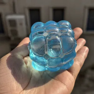 Blue translucent ice cube squishy toy with a unique bubble texture for stress relief
