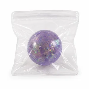 Violetter Glitzer-Quetschball als Stressabbau-Spielzeug in transparenter Packung