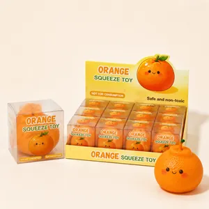 Realistic orange squeeze stress relief toy with individual and display box packaging