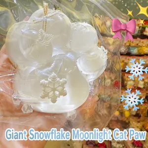 Detailed close-up of a giant white cat paw squishy toy made of TPR in transparent packaging