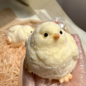 Realistic yellow fuzzy chick squishy toy made of food-grade silicone for stress relief.