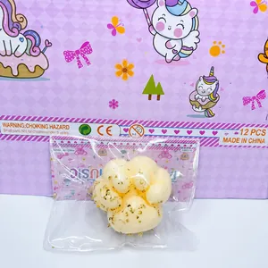Detail view of a cat paw shaped squishy decompression toy with gold leaf flakes inside.