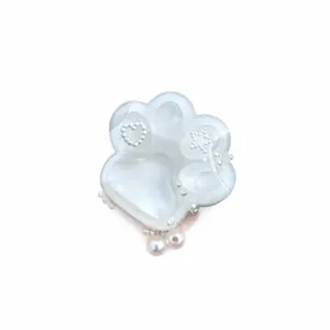 White translucent cat paw squishy toy with decorative pearls heart and star for stress relief
