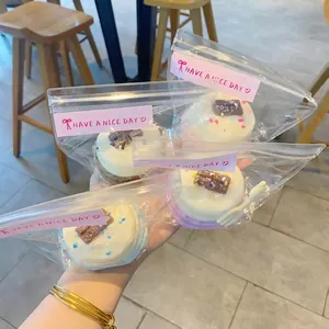 Miniature Basque cake squishy toys in clear gift bags with decorative pink labels