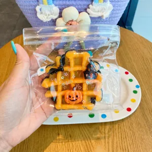 Halloween squishy toy in waffle shape with pumpkin and bat details for stress relief