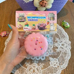 Close-up of pink Basque cake squeeze toy in packaging for stress relief and decompression.