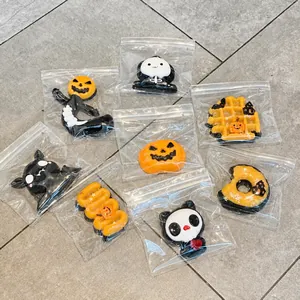 Detailed shot of Halloween-themed squishy toys in individual clear plastic packaging