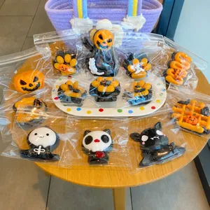 Collection of Halloween-themed squishy toys in clear packaging for stress relief