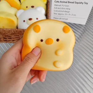Detail view of squeezing a slow-rebound cartoon toast squishy toy for stress relief