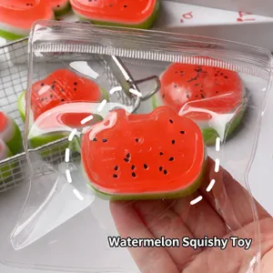 Detailed close-up of a watermelon-themed cat-shaped slow rising squishy toy in clear packaging