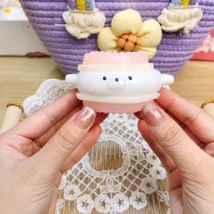 Close-up of a cute animal squishy toy for stress relief with a soft pink and white texture