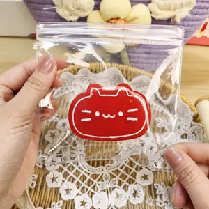 Close-up of red cat-shaped slow rebound squishy toy inside a clear protective zip-lock bag