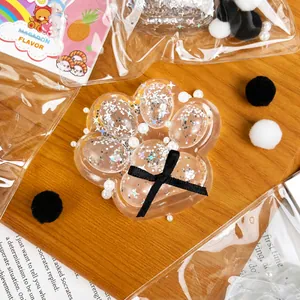 Transparent cat paw squishy toy with glitter and pearls for stress relief