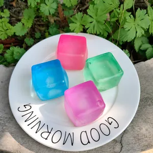 Colorful translucent ice cube squishy toys for stress relief placed on a decorative white plate