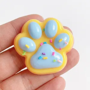 Jouet anti-stress squishy patte de chat avec texte Sweet et vermicelles.