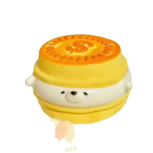 Cute golden coin dog squishy toy with slow rebound effect for stress relief and fun.