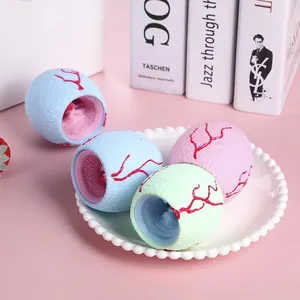 Close-up macro view of textured pastel dinosaur egg stress relief squeeze toys on a white plate