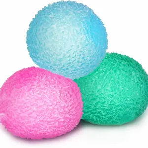 Set of three textured maltose squishy stress relief toys in pink blue and green colors
