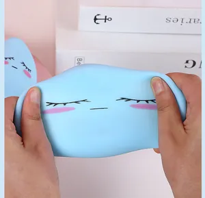 Close-up of hands stretching a blue cloud-shaped TPR squishy stress relief toy
