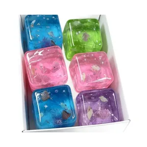 Macro view of colorful translucent ocean-themed squishy cubes with embedded seashells