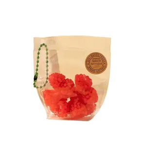 Jouets sensoriels framboise rouge réalistes dans un sac avec chaîne à billes