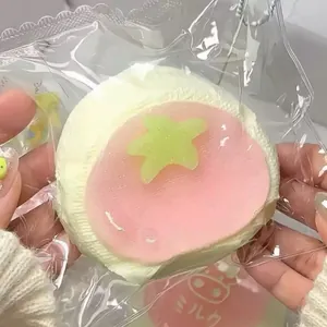 Detailed view of the cheesecake squishy toy with a green star decoration for stress relief