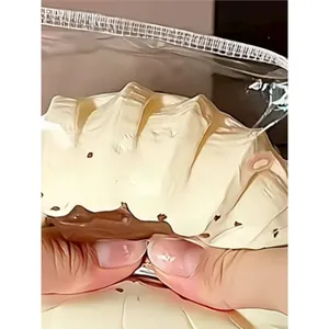 Detailed macro view of cream and chocolate Gugelhupf cake slow rebound silicone squishy toy.