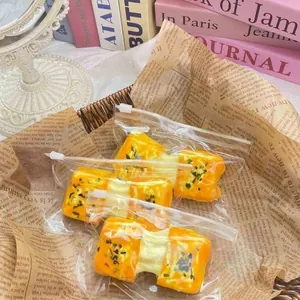 Detail of silicone squishy toy shaped like seaweed pulled-cheese rice cake in bags.
