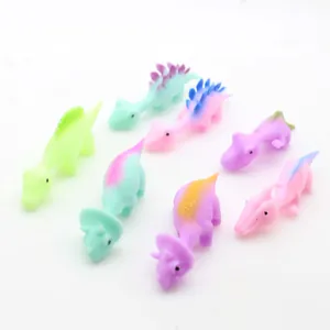 Close-up of colorful slingshot dinosaur fidget toys in various vibrant and playful pastel shades