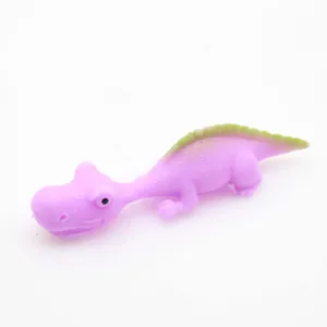 Side view macro detail showing the purple and green stretchy dinosaur slingshot toy