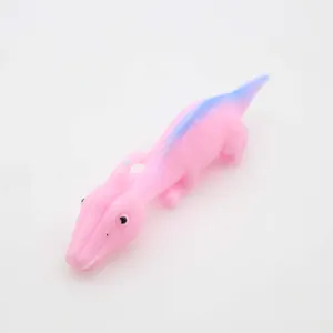 Detail view of pink stretchy catapult dinosaur toy for stress relief