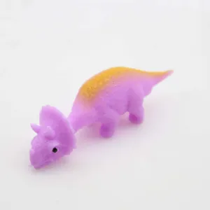 Detail view of a purple and orange stretchy triceratops slingshot toy for stress relief
