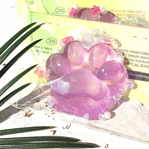 Glittery purple cat paw squishy stress relief toy with decorative butterfly and pearl beads