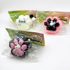 Set of three colorful silicone cat claw squishy toys in individual packaging