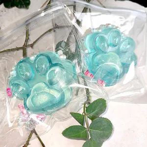 Close-up of glitter blue cat paw squishy toys in clear packaging